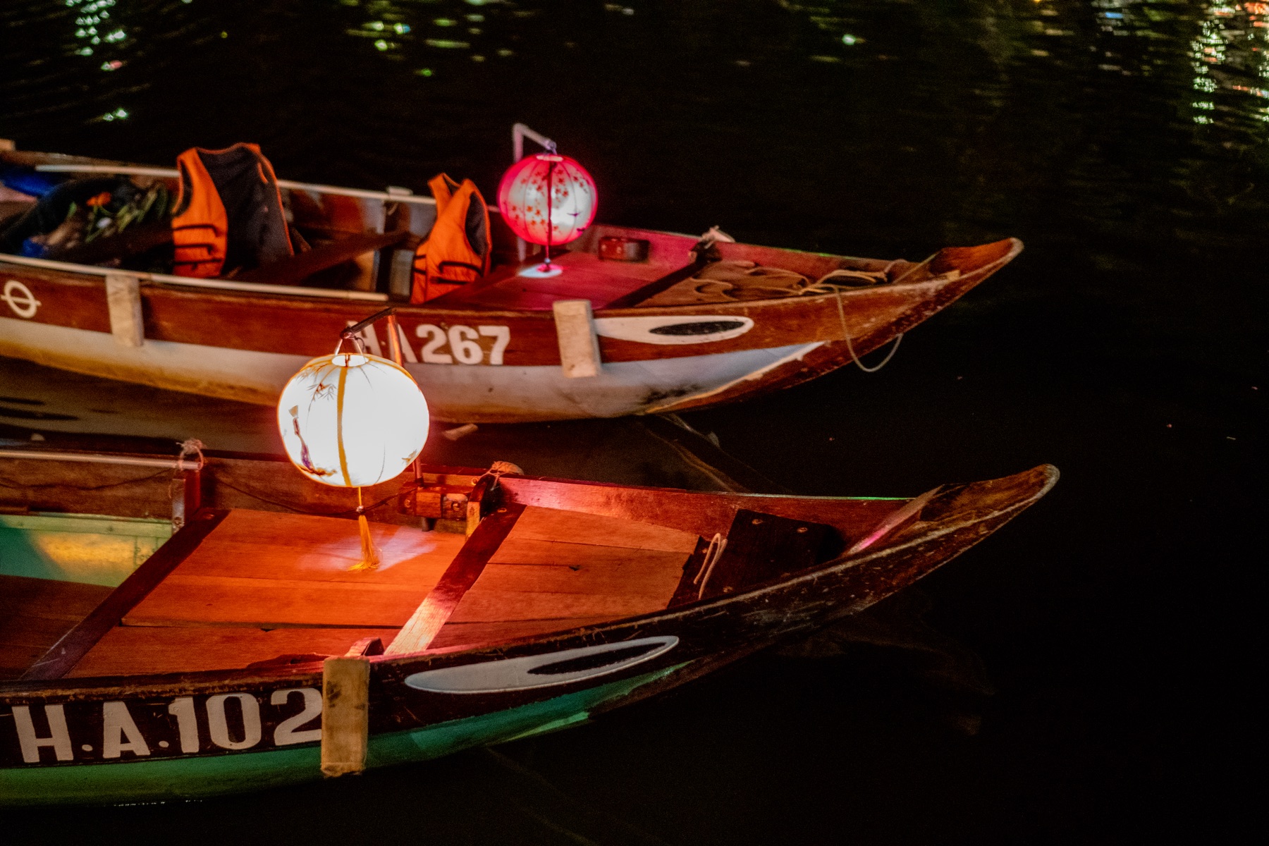 Traditional boats with lanterns on water in Hoi An
